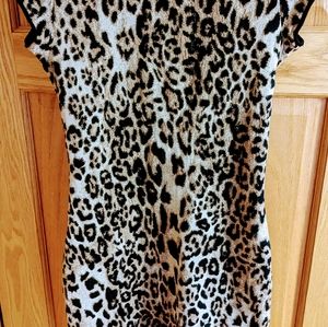 Chic, knit, form fitting, knee length, animal print dress by Marc Cain.